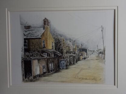 View of victorian terraced houses from the back on bin day