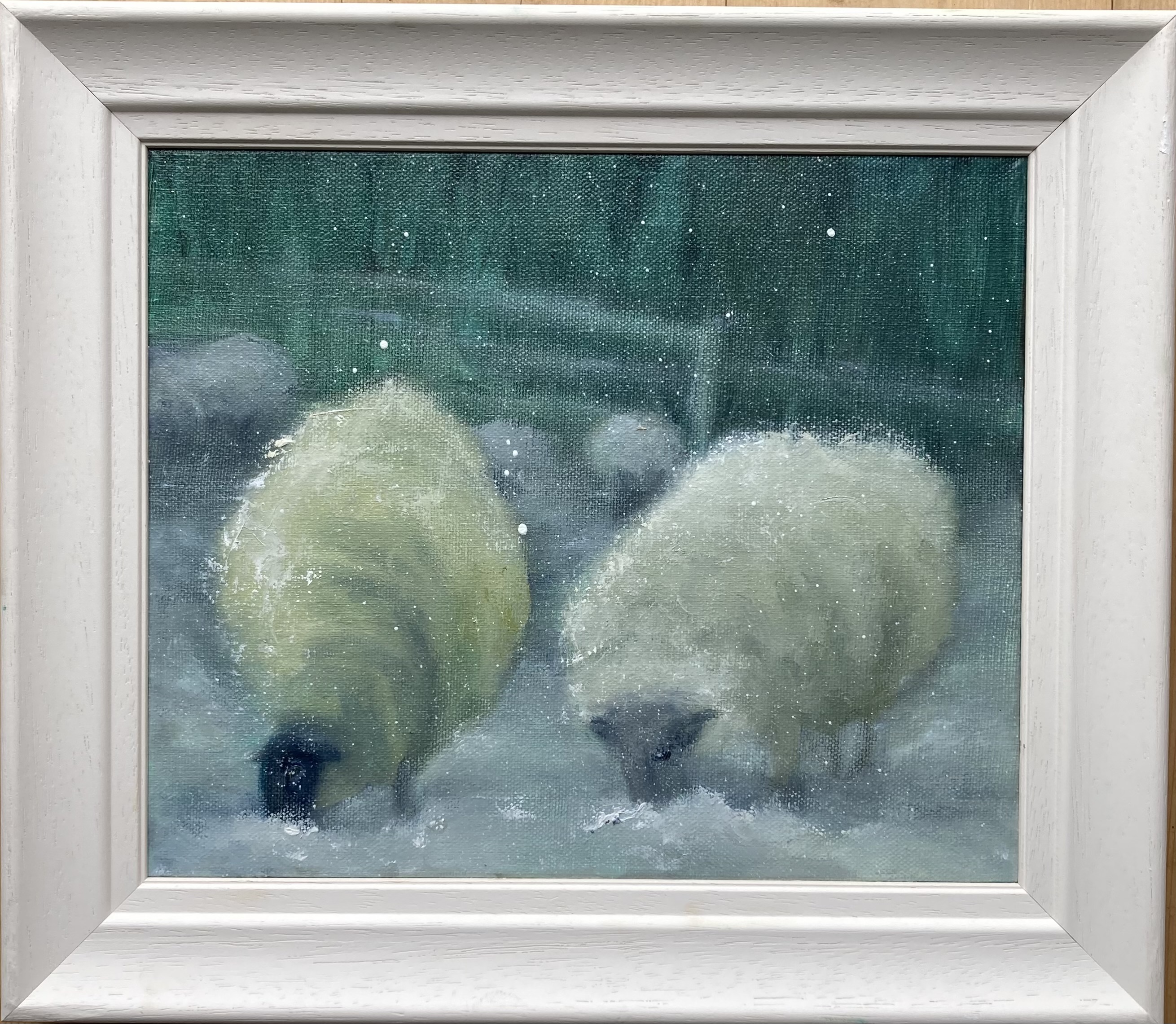 This captivating painting, "Sheep in the Snow," beautifully captures the serene and peaceful essence of winter in the Irish countryside. The delicate brushstrokes bring to life a group of sheep huddled together in a snowy landscape, evoking a sense of warmth and tranquility amidst the cold. The soft, muted colors of the snow contrast with the rich textures of the sheep's wool, creating a visually striking composition that celebrates the quiet beauty of rural Ireland in winter. This artwork is perfect for those who appreciate pastoral scenes and the charm of the Irish landscape.